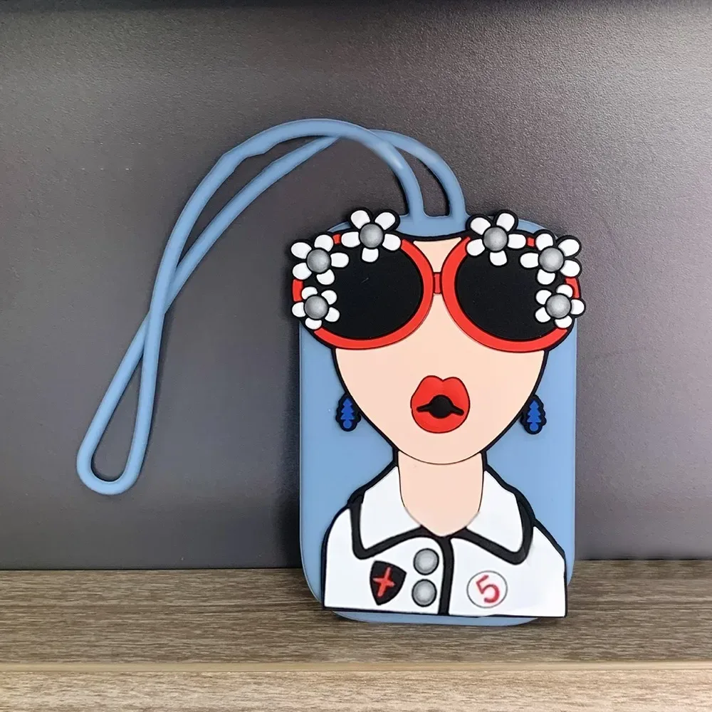 étiquette bagage caoutchouc visage lunettes fleurs géométrique bleu rose blanc voyage identification valise nom téléphone