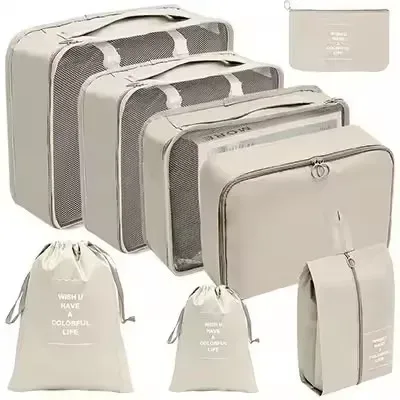 organisateur voyage polyester beige clair sac rangement vêtements chaussures sous-vêtements pochettes transparentes cubes modularité transport