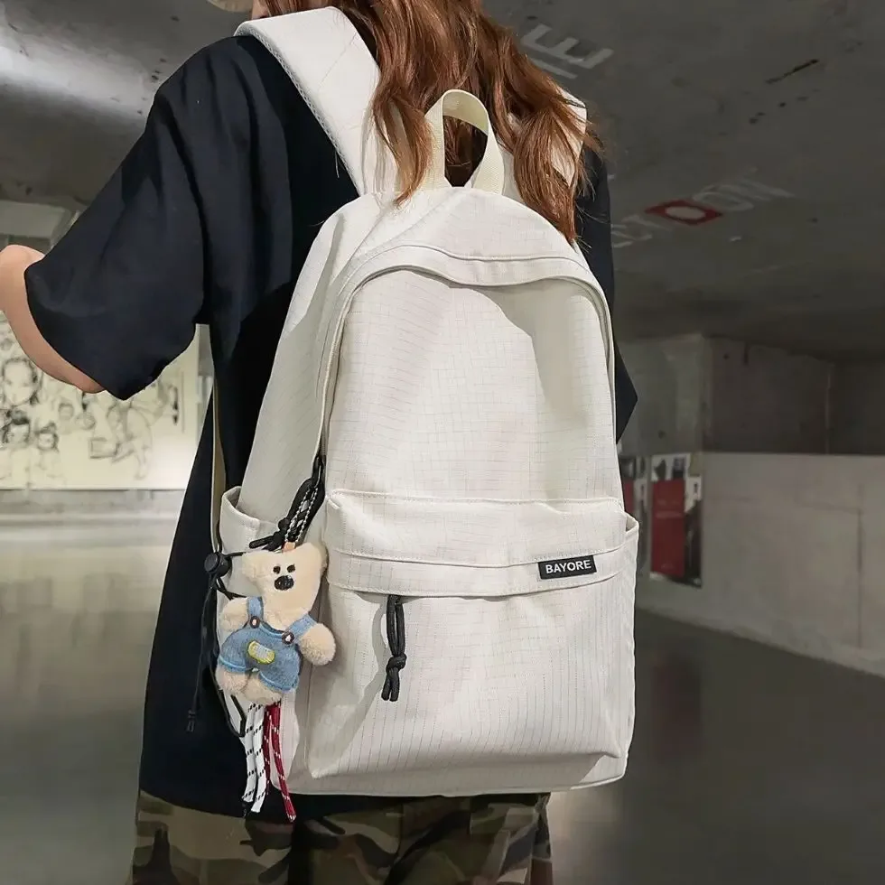 sac à dos de voyage décontracté grande capacité pour homme, motif quadrillé simple, sac d'école en nylon, style campus jeune, système anti-gravité