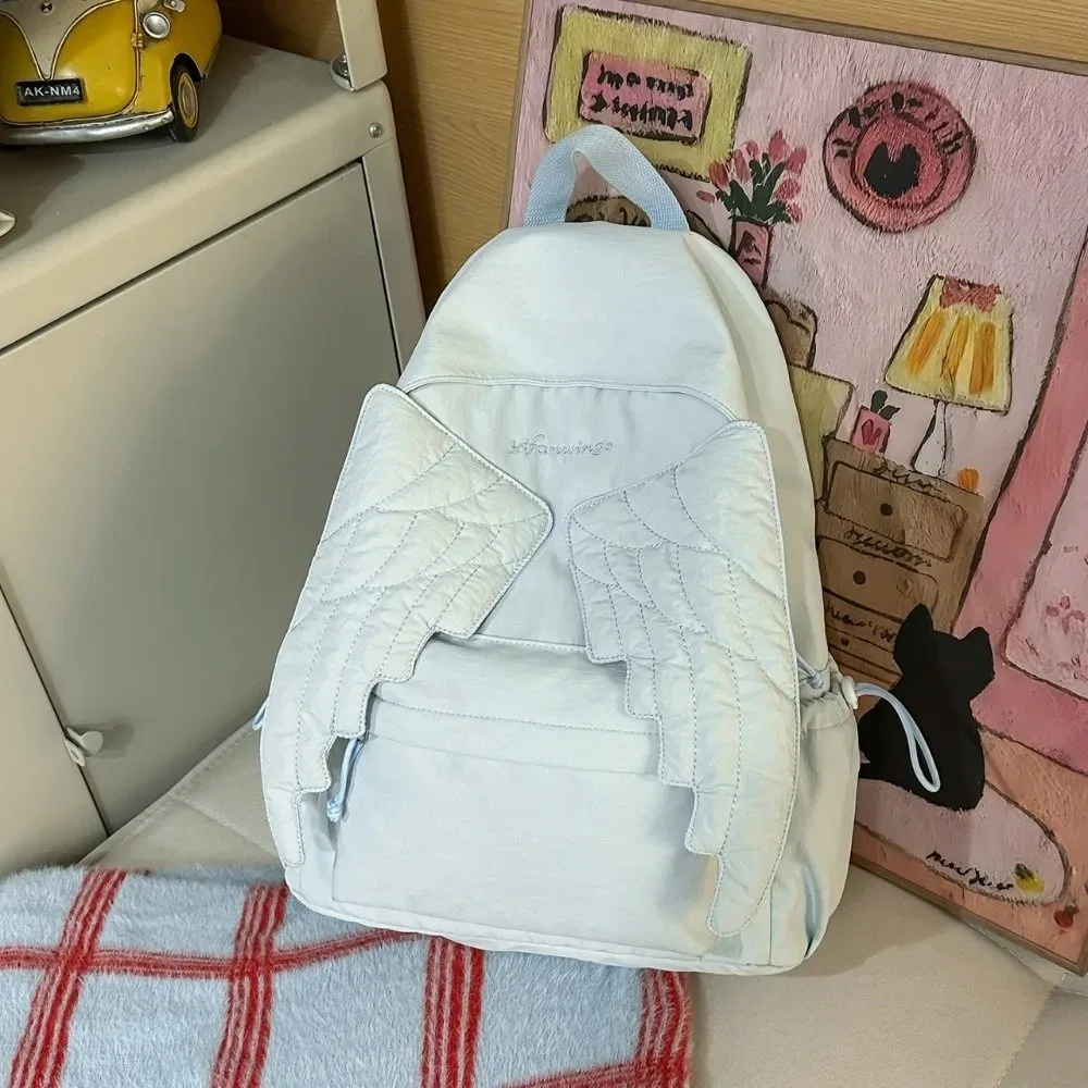 sac à dos polyvalent à ailes d'ange, couleur unie, grande capacité, sac à dos en toile, style y2k, motif brodé, sac à dos en nylon