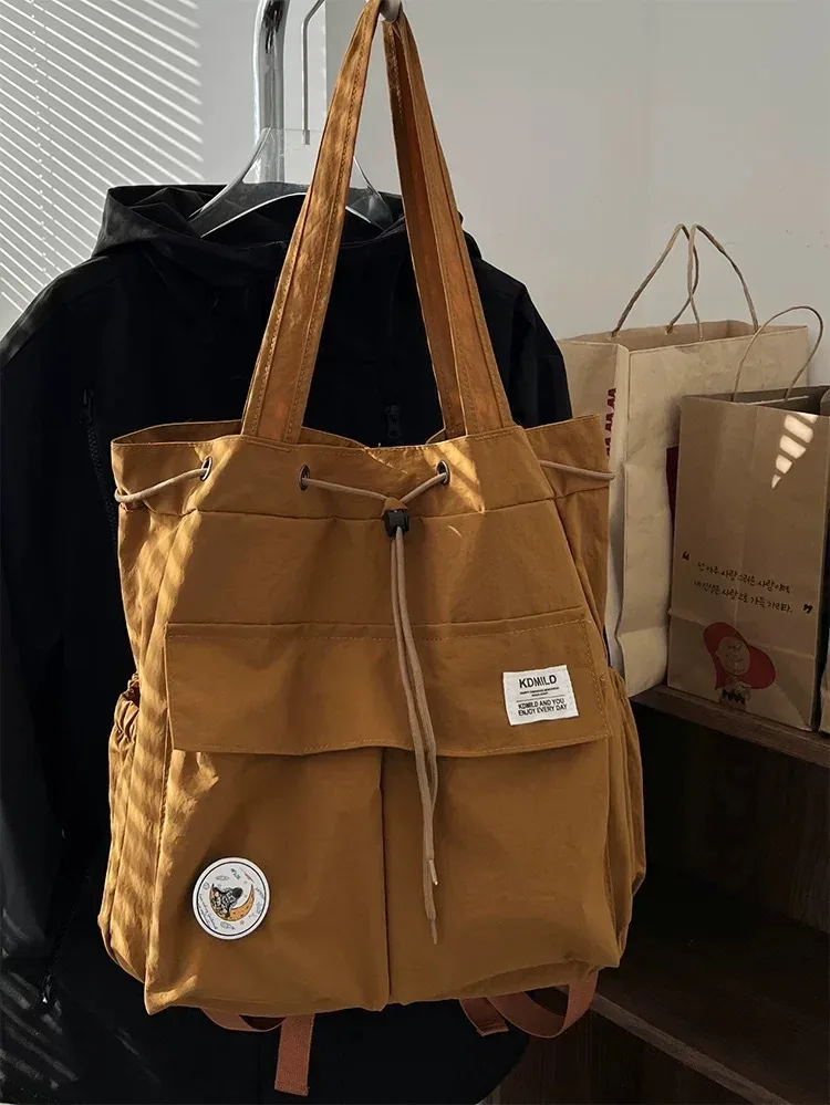 sac à dos léger et décontracté pour femme, idéal pour les voyages, les loisirs en plein air, en nylon, capacité 20-35l, avec compartiment pour ordinateur portable 14 pouces