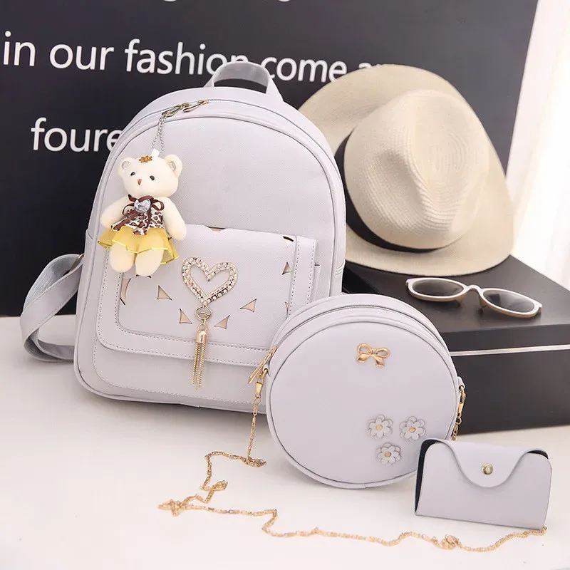 sac dos cuir synthétique gris motif géométrique relief bandoulière amovible porte-monnaie inclus voyage femme