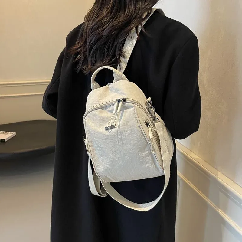 Mini sac à dos multifonctionnel en nylon, sac de voyage convertible décontracté à bandoulière pour femme, sac à dos quotidien multi-poches pour l'extérieur