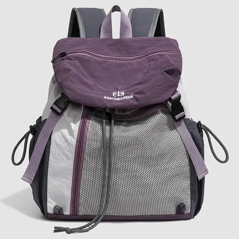sac dos nylon noir poche zip latérale maille grise bretelles bandes logo blanc style voyage capacité litres