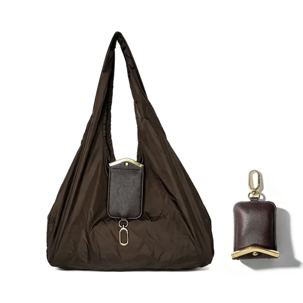 sac fourre-tout mini pliable anti-déchirure en similicuir couleur unie avec porte-clés et garniture métallique, pochette 2-en-1 pour sac et breloque