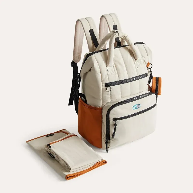 sac dos polyester beige accents verts poches multiples grande capacité maternité sorties mains libres bébé ordinateur portable