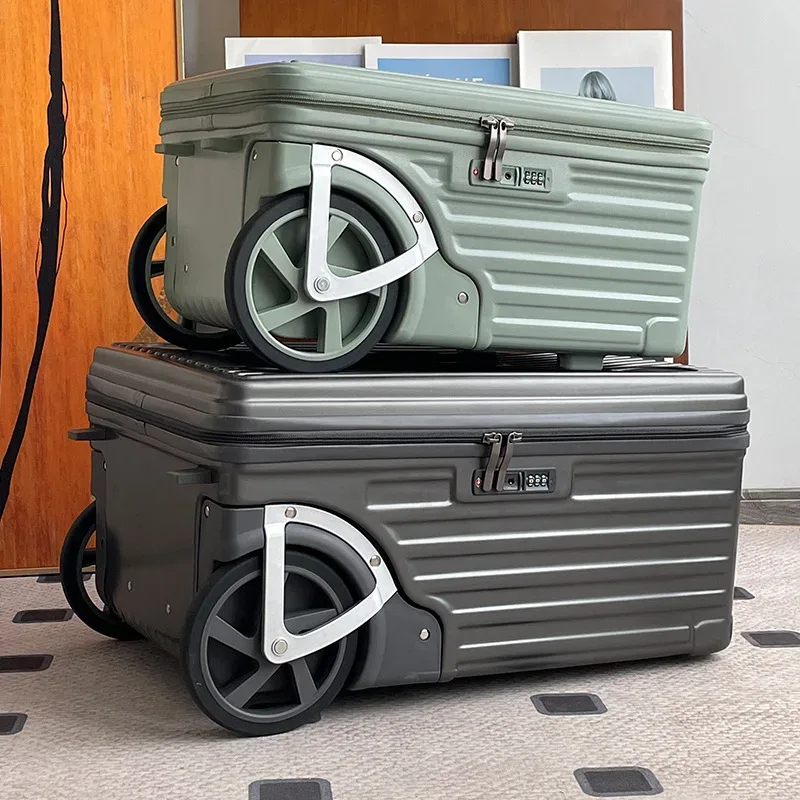 valise roulettes toupie abs gris clair orange poignées sécurité motif intérieur cercles noirs gris durabilité transport