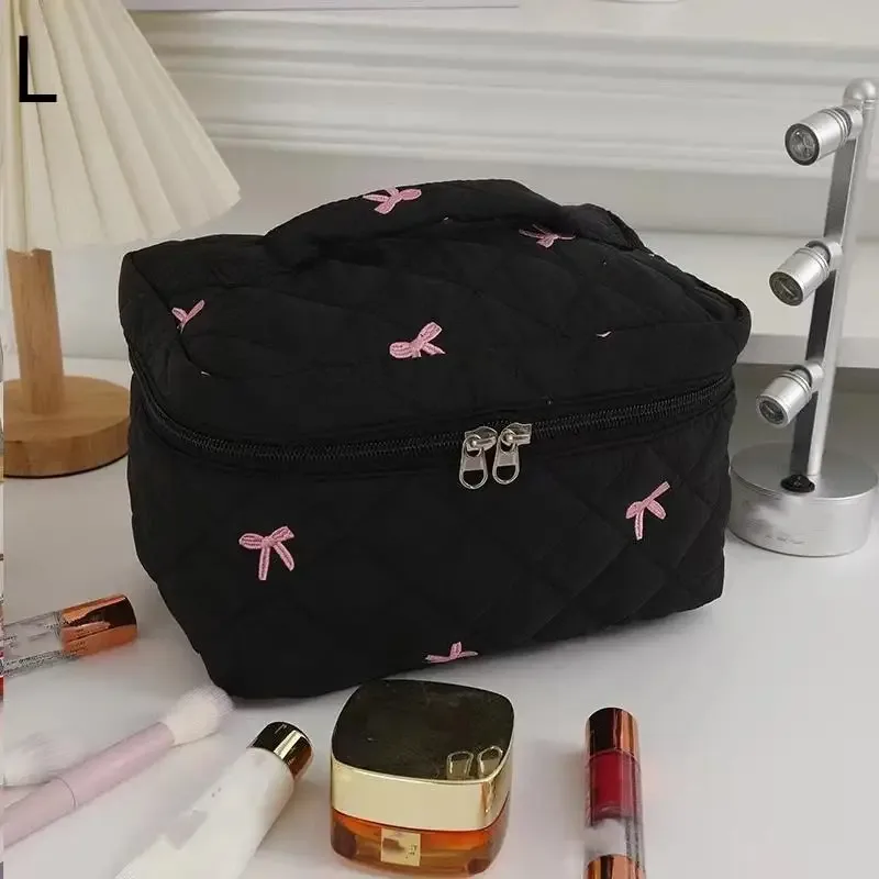 organisateur voyage polyester noir motif géométrique nœuds roses grande capacité matelassé usage journalier cosmétiques maquillage transport facile