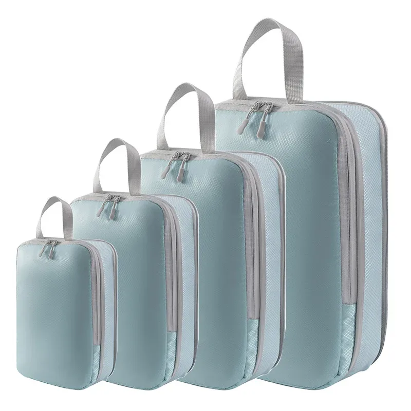 organisateur voyage polyester blanc bandes grises format rectangulaire poignées grises compression vêtements articles toilette rangement valise