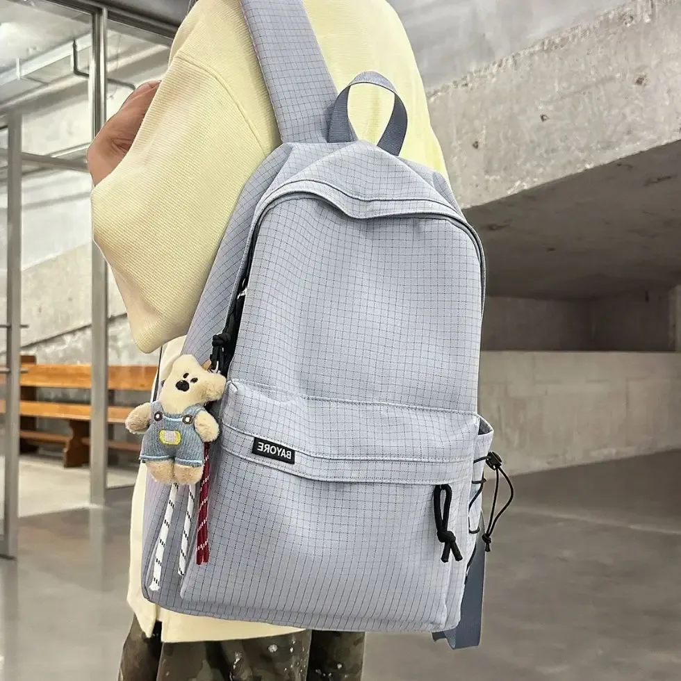 sac à dos de voyage décontracté grande capacité pour homme, motif quadrillé simple, sac d'école en nylon, style campus jeune, système anti-gravité