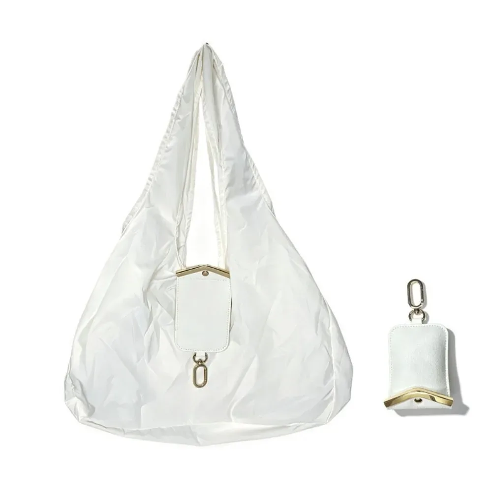 sac fourre-tout pliable 2-en-1 couleur unie avec porte-clés, mini sac de courses peu encombrant, garniture métallique, résistant aux déchirures, pochette porte-breloques