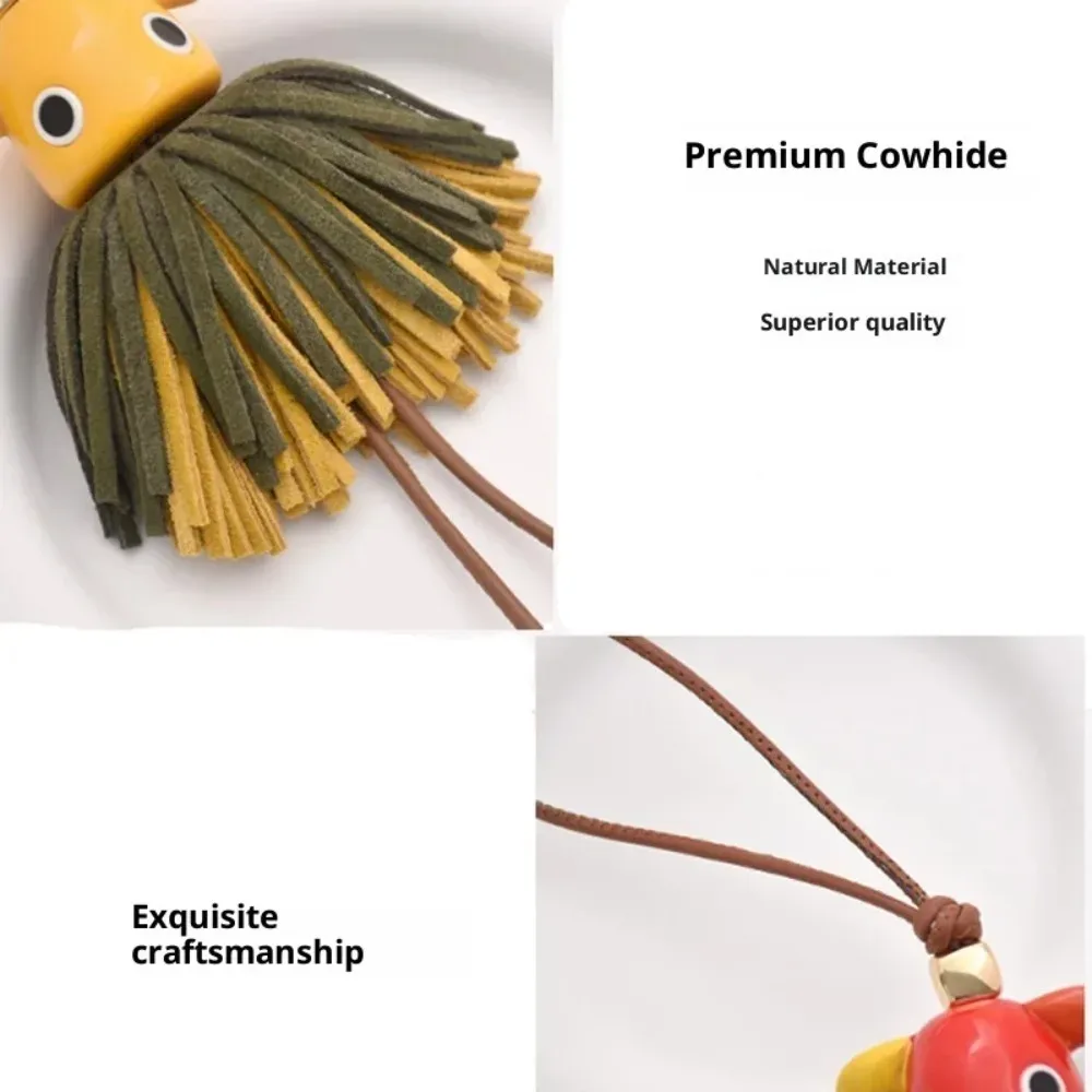 breloque de sac en cuir véritable avec grand œil et pompon, inspirée des créateurs de luxe, porte-clés à franges pour sacs à main, sacs à dos et accessoires de sac fourre-tout pour femmes