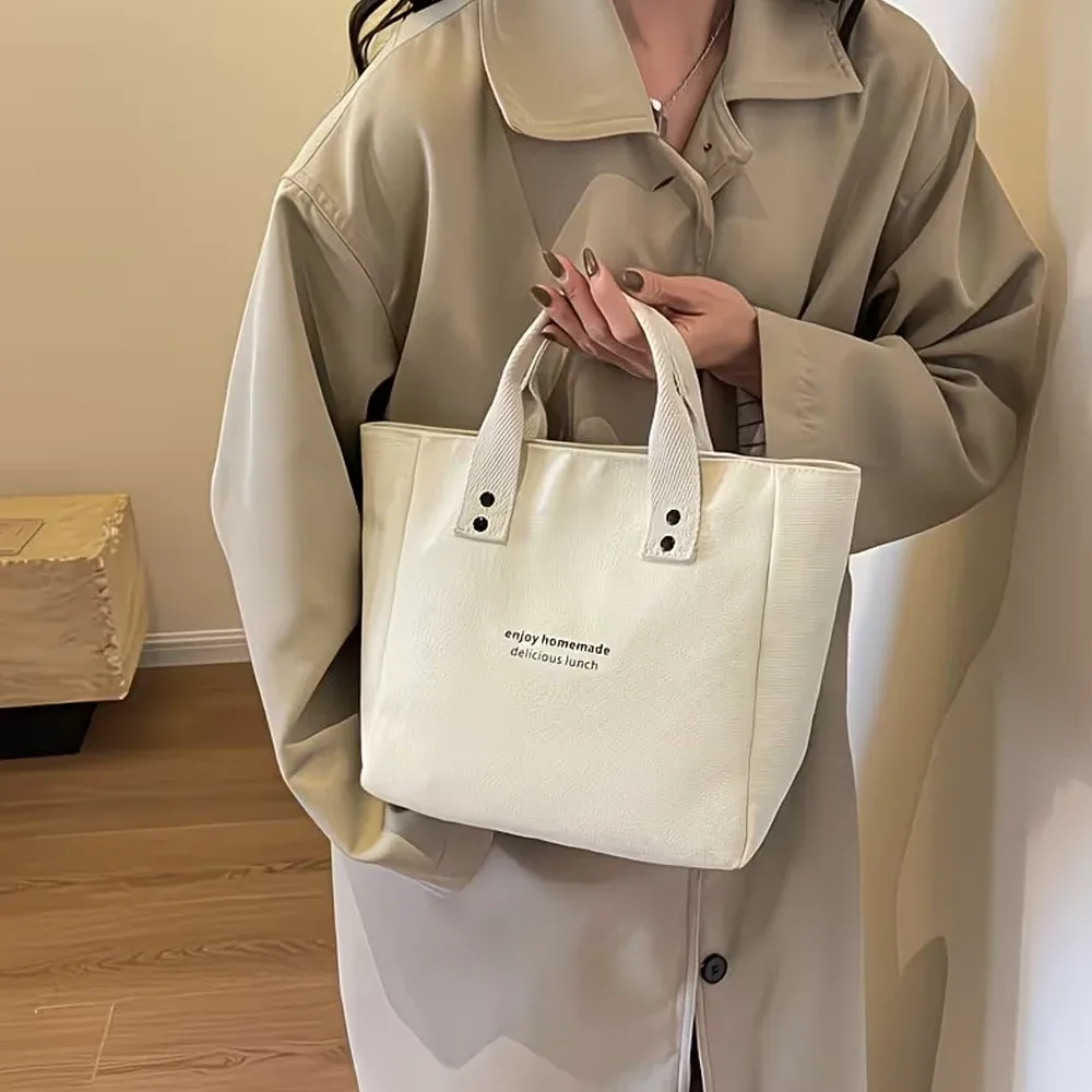 sac fourre-tout décontracté en toile avec pendentif cloche et fermeture éclair ; ce sac fourre-tout élégant et durable est parfait pour l'école et le travail