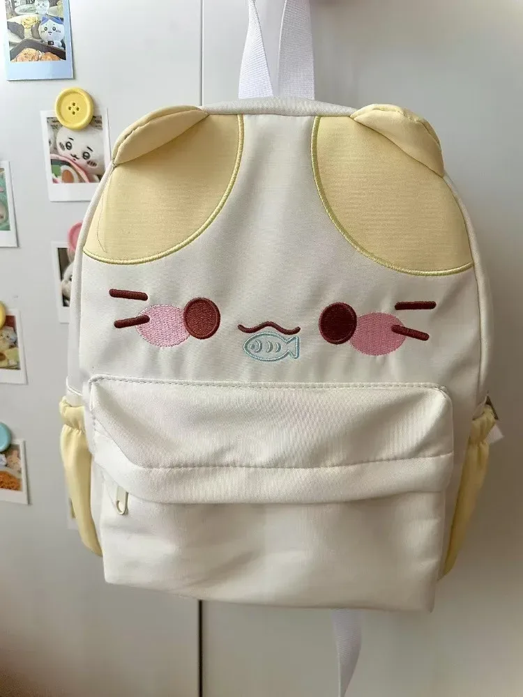 sac à dos imperméable en nylon pour femme avec motif chat dessinant une fille mangeant du poisson, sac d'école pour filles avec détails brodés, sac à livres