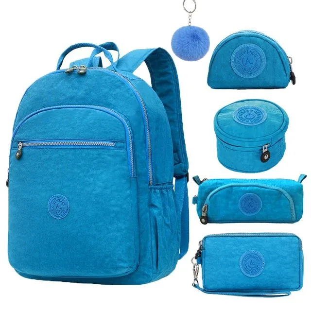 sac dos nylon gris anthracite compartiments poches latérales glissière accessoires pompon porte monnaie voyage école adolescente