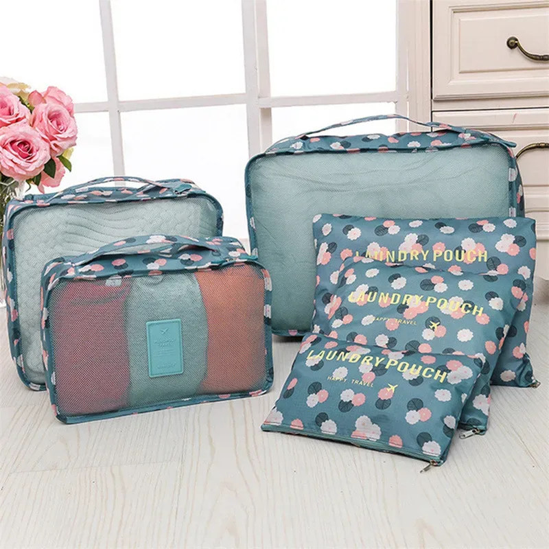 organisateur voyage polyester bleu transparent rectangulaire poignée intégrée fleurs léopard motif lettre format rangement vêtements chaussures compression