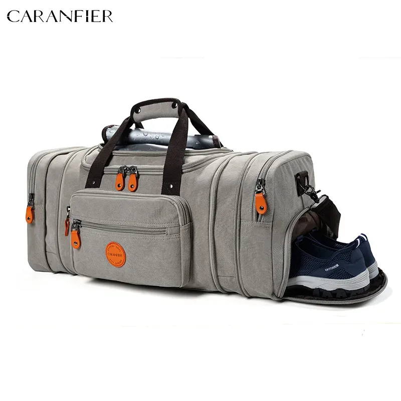 sac voyage toile gris poignée noire fermetures glissière orange intérieur marron compartiments extensibles polyvalents week end sport