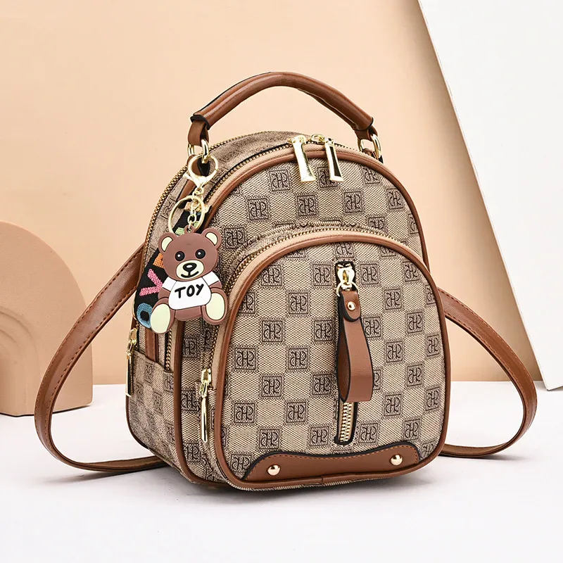 sac dos cuir similicuir vert motif géométrique pomponne métallique bandoulière amovible compartiment intérieur fermeture éclair polyvalent voyage
