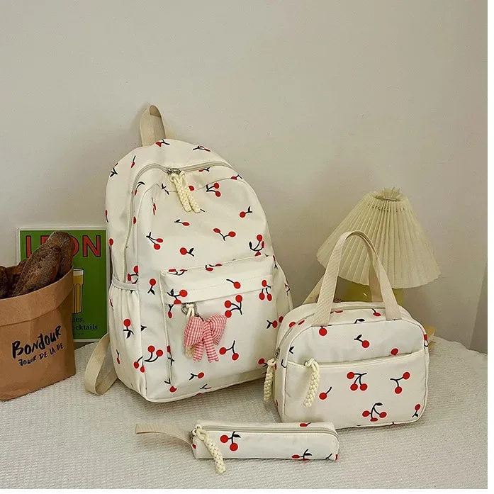 sac dos polyester imprimé cerises rouge fond rose blanc noir pochette assortie 20 35 litres unisexe voyage école