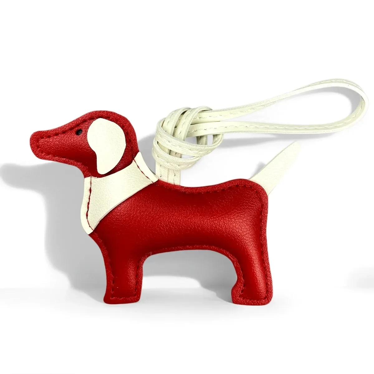 sac dos cuir motif chien silhouette orelles criniere couleurs contrastantes ornements voyage usage journee accessoires sac main porte clefs