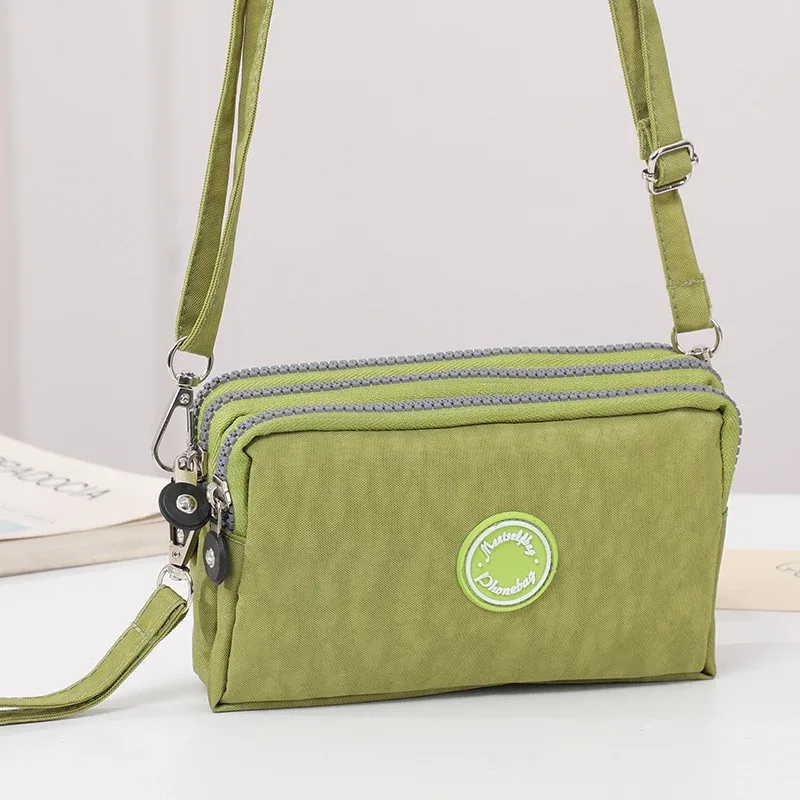 sac à bandoulière de grande capacité pour femmes, sac à bandoulière simple avec trois fermetures éclair pour téléphone et sac de rangement à changement ample