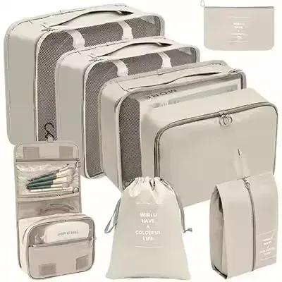 organisateur voyage polyester beige clair sac rangement vêtements chaussures sous-vêtements pochettes transparentes cubes modularité transport