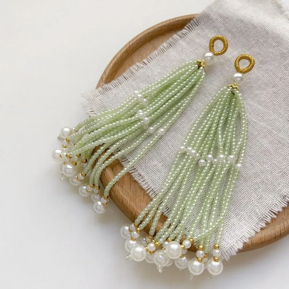 boucles oreilles perlées style ancien multicolores ornementation sac dos accessoires bijoux diy franges perles vertes blanches dorées