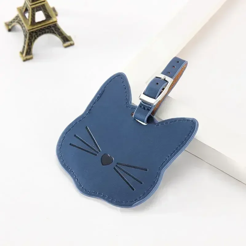 étiquette bagage cuir apparent visage chat gravé bleu marine voyage accessoire identification nom adresse