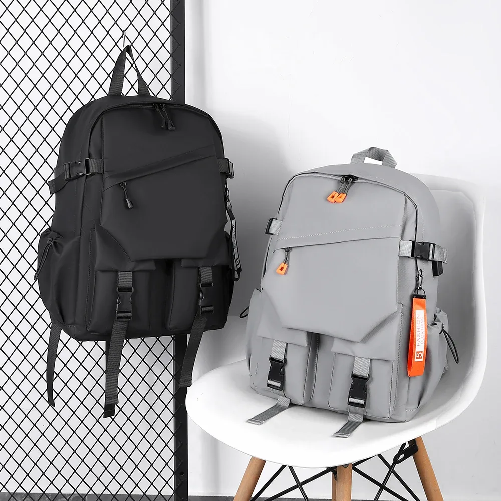 un tissu hydrofuge élégant, simple et de haute qualité de 15,6 pouces avec le même sac à bandoulière pour hommes et femmes.