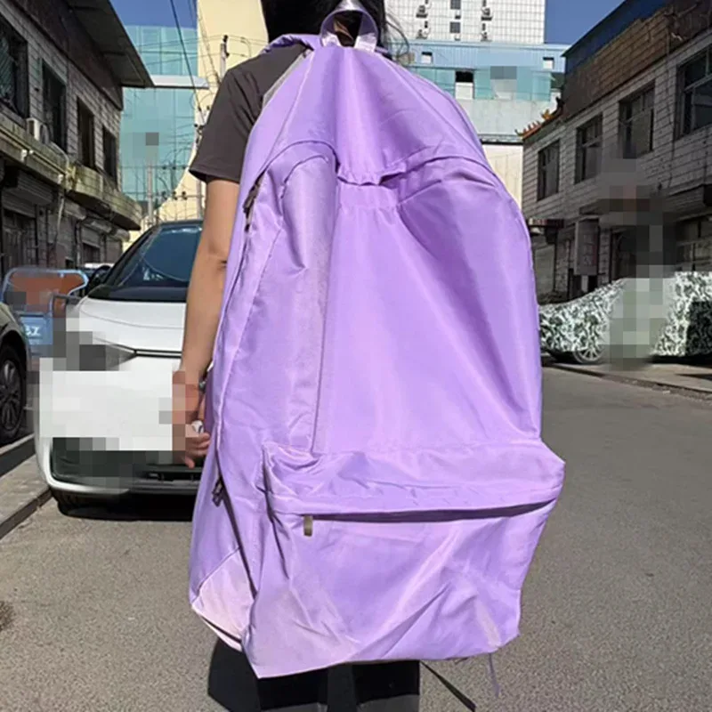 sac dos polyester violet vert bleu rouge jaune rose forme trapézoïdale poches latérales fermeture glissière usage voyage grande capacité