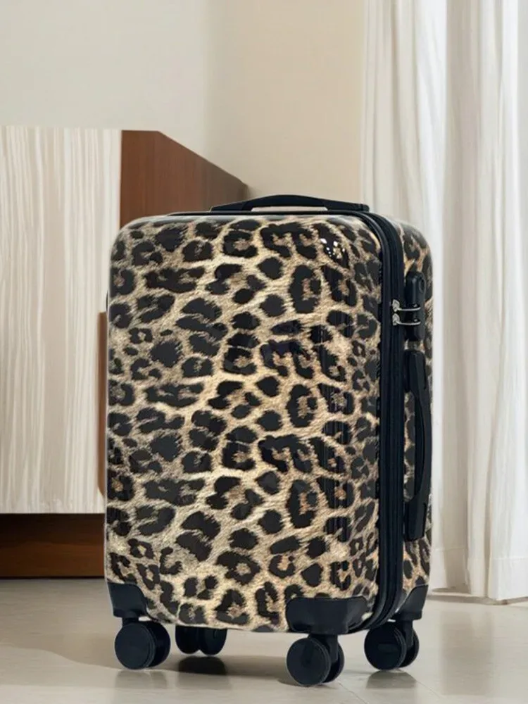 valise motif léopard beige roulettes noires poignée supérieure compartiments intérieur gris clair voyage femme