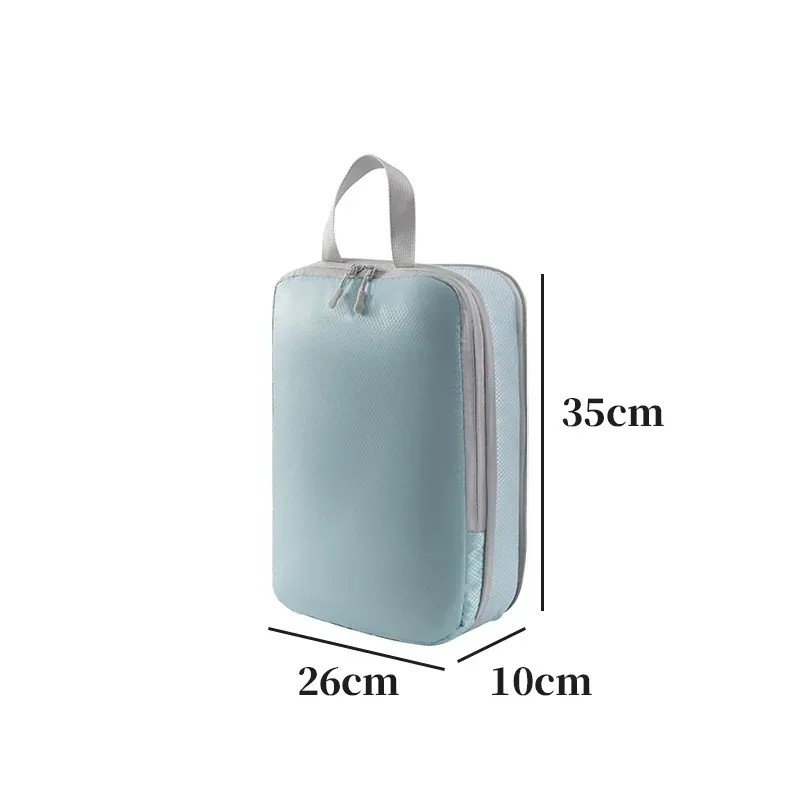 organisateur voyage polyester blanc bandes grises format rectangulaire poignées grises compression vêtements articles toilette rangement valise