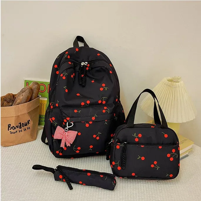 sac dos polyester imprimé cerises rouge fond rose blanc noir pochette assortie 20 35 litres unisexe voyage école