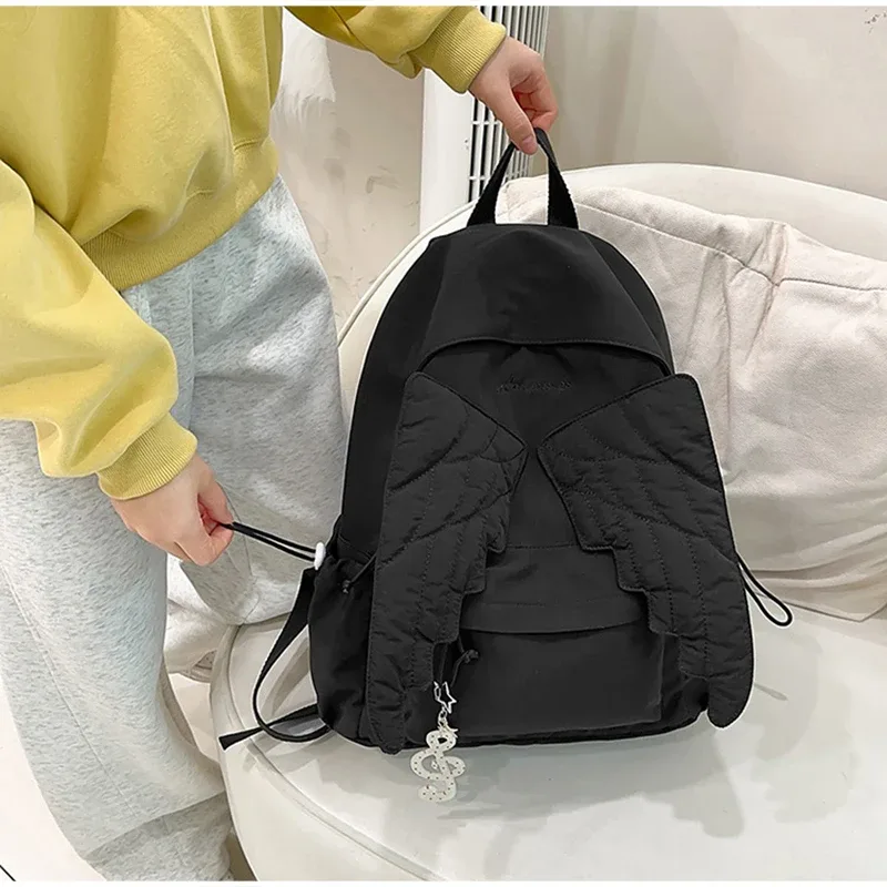 sac à dos ailes d'ange de marque pour filles, niche douce et polyvalente, en toile, nouveau sac de voyage tendance y2k avec pompon, grande capacité