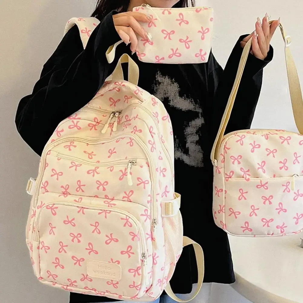 sac dos polyester motifs nœuds blancs fond noir beige deux petits sacs accessoires usage voyage école