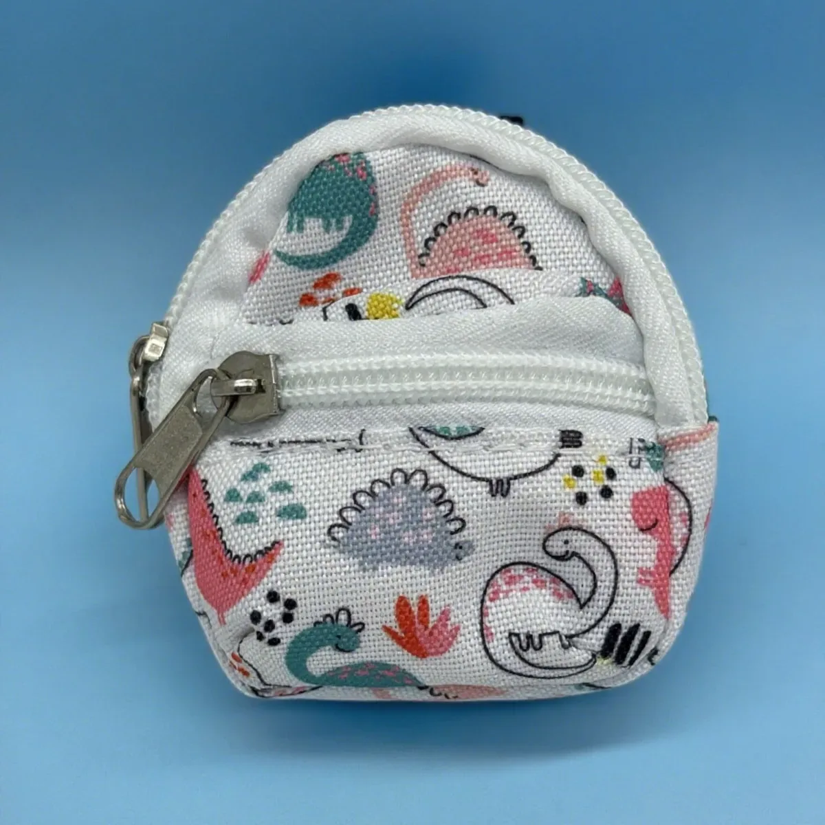 sac dos nylon petit format ovale fermeture glissière poche latérale double épaule poches latérales couleur vivante usage voyage