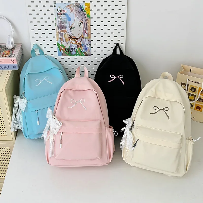 sac à dos portable brodé avec nœud pour filles, sac d'école en nylon de couleur unie pour étudiants, sac à dos de voyage léger de grande capacité pour femmes