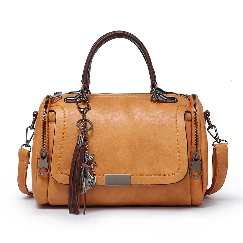 sac dos cuir pu marron motif coutures poignée supérieure pince chat chaînette format ovale voyage fille