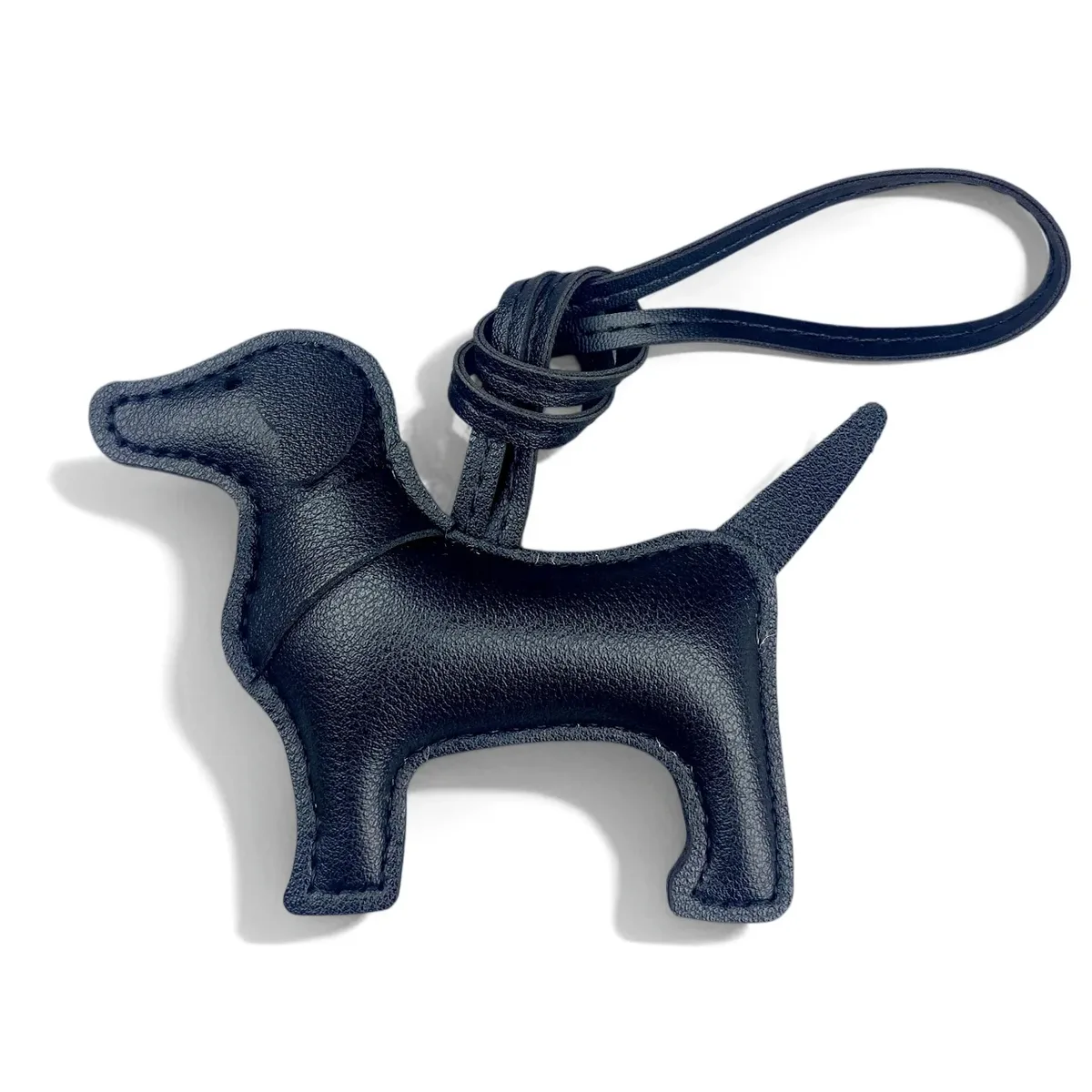 sac dos cuir motif chien silhouette orelles criniere couleurs contrastantes ornements voyage usage journee accessoires sac main porte clefs