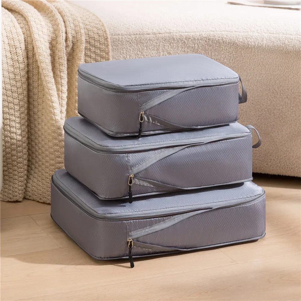 organisateur voyage nylon noir beige compressible cube sac rangement format rectangulaire zips noirs usage voyage empilement sol clair