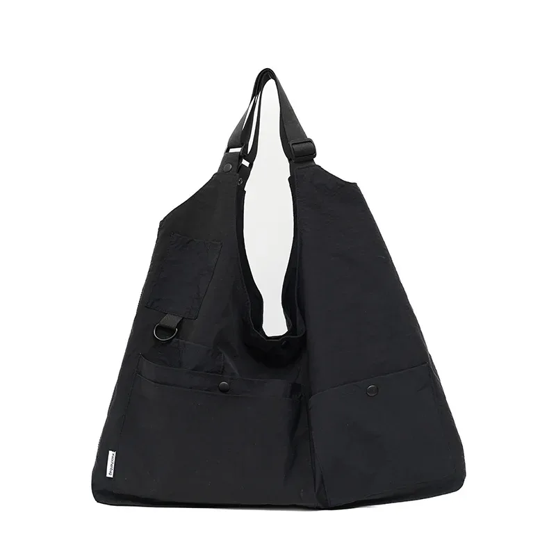 sac dos nylon jaune vert rose poches ouvertes bandoulière arquée fermeture éclair capacité inferieure deuxize litres usage voyage décontracté jacquard