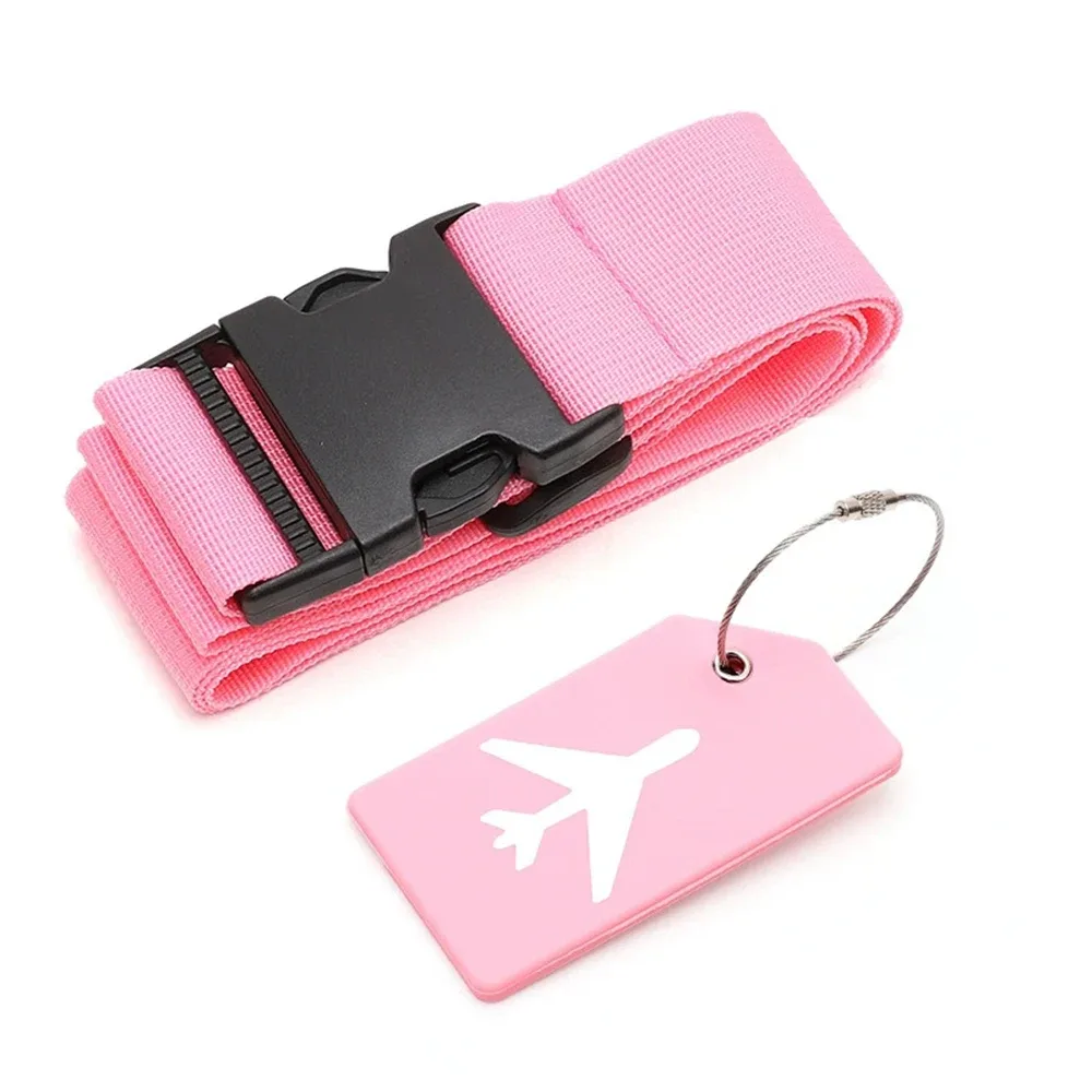 ceinture bagage nylon motif avion blanc fond rose voyage adaptation taille valises couleurs variées étiquette tag correspondant