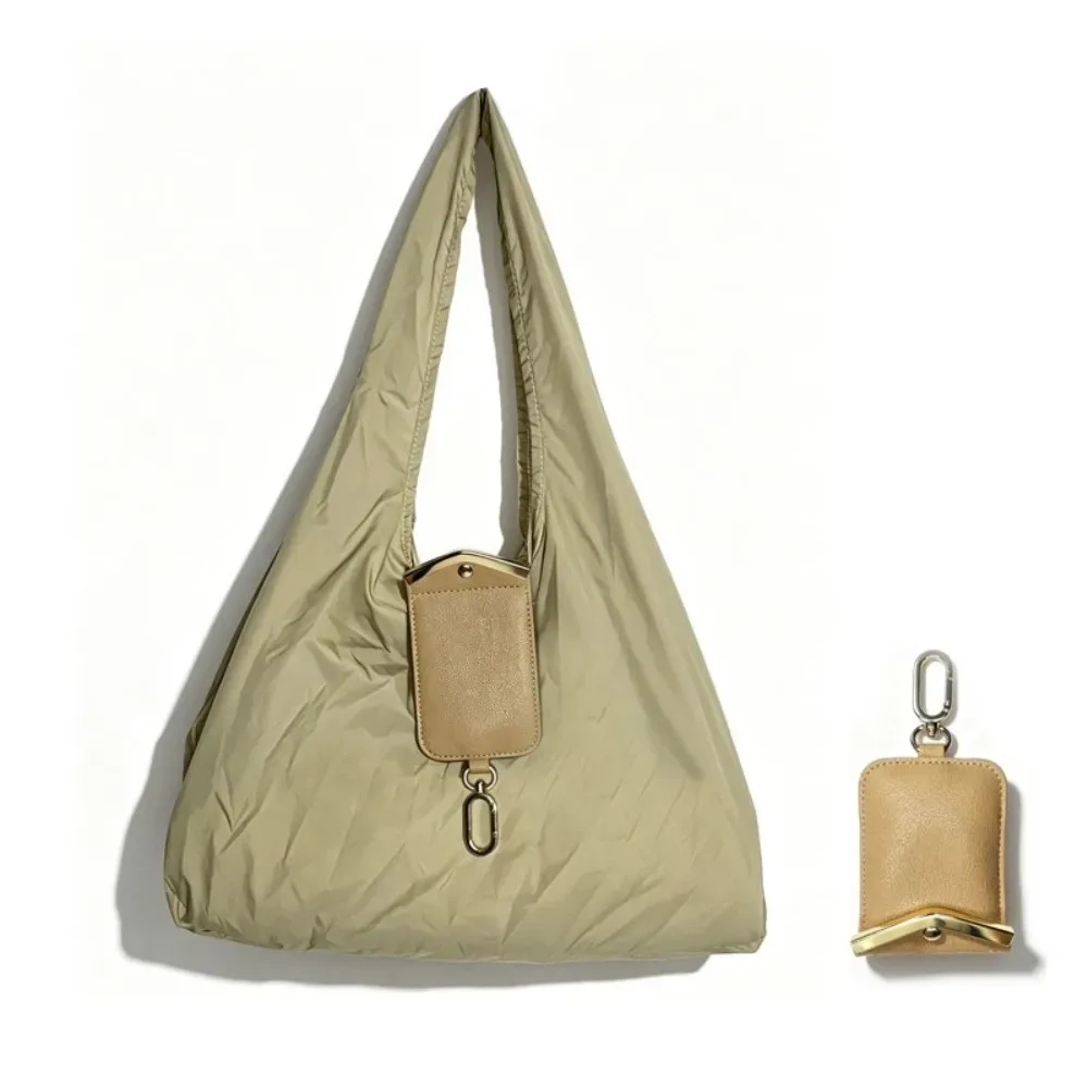 sac fourre-tout mini pliable anti-déchirure en similicuir couleur unie avec porte-clés et garniture métallique, pochette 2-en-1 pour sac et breloque