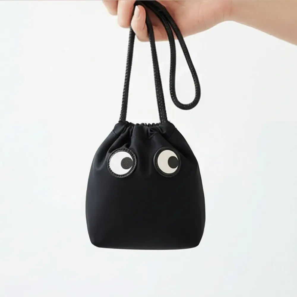 trousse de maquillage en nylon tendance avec cordon de serrage, motif dessin animé grands yeux, sac cosmétique mignon pour l'organisation des maquillages