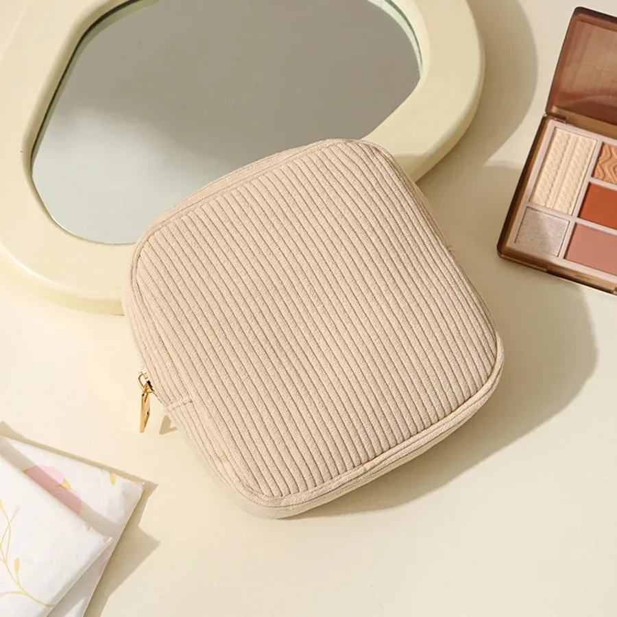 pochette polyester beige rayures verticales cosmétiques serviettes hygiéniques voyage femmes organisateur tranche usage polyvalent