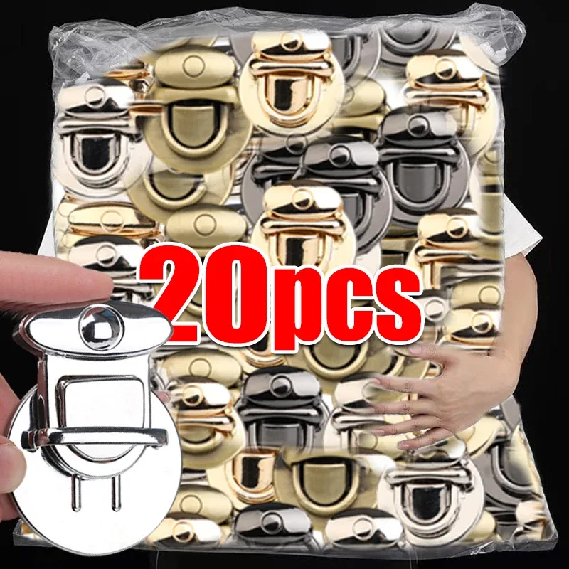 cadenas serrure tsa métal forme ovale bouton central poignée incurve couleur doré voyage sac main bandoulière transversale portefeuille usage travail artisanal