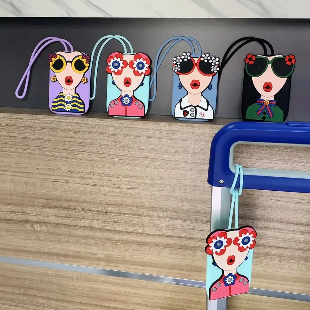 étiquette bagage caoutchouc visage lunettes fleurs géométrique bleu rose blanc voyage identification valise nom téléphone