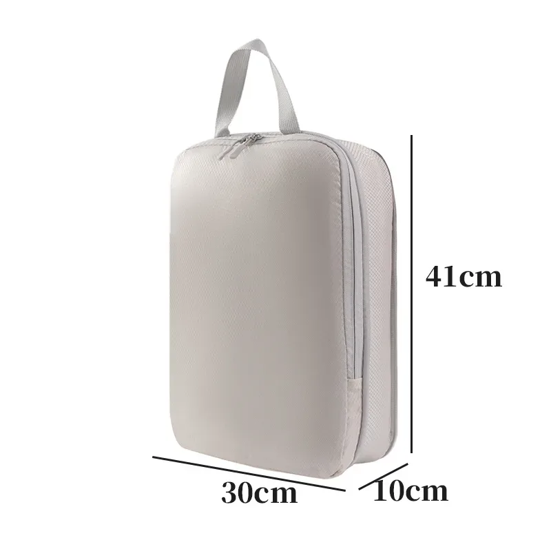 organisateur voyage polyester blanc bandes grises format rectangulaire poignées grises compression vêtements articles toilette rangement valise