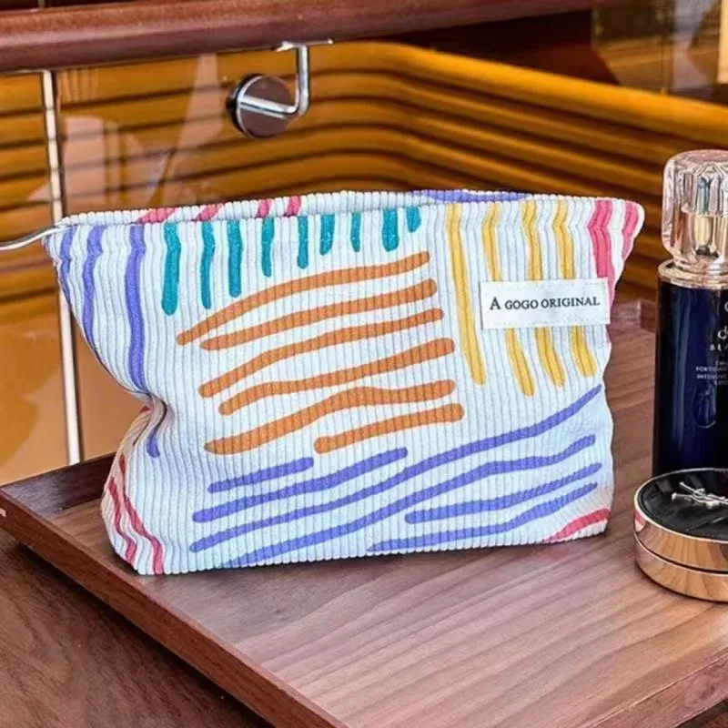trousse de toilette en velours côtelé, sac de rangement portable rayé pour produits de soin, essentiels de voyage pour étudiants et déplacements professionnels
