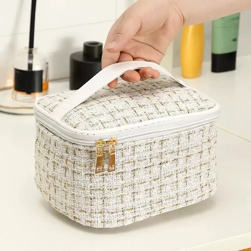 trousse toilette tweed luxe blanc doré zip double poignée supérieure compartiments multiples voyage femmes